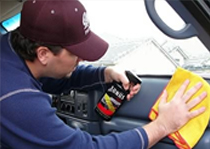 Technician performing auto glass service
